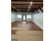 Bright and airy living room with wood-look floors, neutral walls, and wood beam ceilings at 854 Clearwater Rd, Sharpsburg, GA 30277