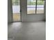 Sunroom with large windows offering lake views and a door providing access to the outdoors at 854 Clearwater Rd, Sharpsburg, GA 30277