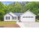 Charming single-story home featuring a two-car garage, complemented by a neatly landscaped front yard at 40 Kelsey Way, Palmetto, GA 30268