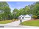 A beautifully landscaped yard leads up to this home, complete with an American flag proudly displayed at 40 Kelsey Way, Palmetto, GA 30268