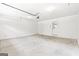Spacious garage with neutral paint, white door to the exterior, and garage door opener at 40 Kelsey Way, Palmetto, GA 30268