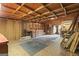 Outbuilding interior shows exposed wood beams, storage, and open space at 40 Kelsey Way, Palmetto, GA 30268