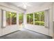 Cozy sunroom featuring lots of windows, neutral tones and access to the outdoors at 40 Kelsey Way, Palmetto, GA 30268