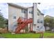 An image of the house's backyard with a deck and stairs at 976 Buckhorn Bnd, Locust Grove, GA 30248