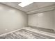 Finished basement room with modern floors and elevated platform at 976 Buckhorn Bnd, Locust Grove, GA 30248