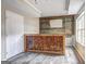 Finished basement wet bar area with wooden bar and modern floors at 976 Buckhorn Bnd, Locust Grove, GA 30248