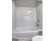Bright white bathtub and shower combination at 976 Buckhorn Bnd, Locust Grove, GA 30248