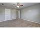 Bedroom with neutral paint, carpet, and view through the doorway to another room at 976 Buckhorn Bnd, Locust Grove, GA 30248