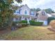 Inviting two-story home with manicured lawn and attached two car garage at 976 Buckhorn Bnd, Locust Grove, GA 30248