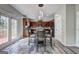 Eat-in kitchen with wood cabinets, stainless appliances, and access to the deck at 976 Buckhorn Bnd, Locust Grove, GA 30248