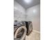 Convenient laundry room equipped with modern washer and dryer units at 976 Buckhorn Bnd, Locust Grove, GA 30248