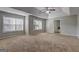 Main bedroom with carpet, ceiling fan, and ensuite bathroom at 976 Buckhorn Bnd, Locust Grove, GA 30248