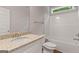 The bathroom features granite countertops, a white vanity, and a soaking tub with white ceramic tile at 115 Oak Road, Locust Grove, GA 30248