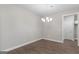 The well-lit dining area features luxury vinyl plank floors and neutral paint at 115 Oak Road, Locust Grove, GA 30248