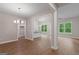 The spacious open-concept living area features luxury vinyl plank floors and abundant natural light at 115 Oak Road, Locust Grove, GA 30248