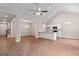 Open-concept living space featuring a staircase, kitchen with an island, and luxury vinyl plank flooring at 115 Oak Road, Locust Grove, GA 30248