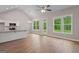 Open-concept living space featuring a kitchen with stainless steel appliances and luxury vinyl plank flooring at 115 Oak Road, Locust Grove, GA 30248