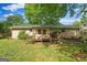 Cozy backyard featuring a brick and siding home, porch, and a view of the well-manicured lawn at 235 Castlegate Cir, Carrollton, GA 30116