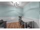 Bright dining area with light-blue walls, white wainscoting, and a modern light fixture at 235 Castlegate Cir, Carrollton, GA 30116