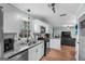Open concept kitchen with stainless appliances, granite counters, and seamless access to living area at 235 Castlegate Cir, Carrollton, GA 30116