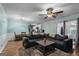 Cozy living room featuring an open floor plan, comfortable sofa, and seamless kitchen access at 235 Castlegate Cir, Carrollton, GA 30116