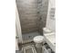 Modern bathroom with tiled walk-in shower, mosaic tile floor, and updated fixtures at 1962 Markone Nw St, Atlanta, GA 30318
