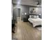 Spacious bedroom featuring hard floors, ceiling fan, wall art, and neutral decor at 1962 Markone Nw St, Atlanta, GA 30318