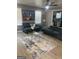 Stylish living room boasts modern furniture, an area rug, and lots of natural light at 1962 Markone Nw St, Atlanta, GA 30318