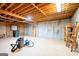Unfinished basement featuring concrete walls, a wood ceiling, and concrete floors at 260 Emerald Lake Dr, Fayetteville, GA 30215