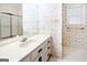 Bathroom with floral wallpaper, a vanity with drawers, and tiled floors at 260 Emerald Lake Dr, Fayetteville, GA 30215