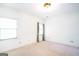 Carpeted bedroom with white walls and two large windows at 260 Emerald Lake Dr, Fayetteville, GA 30215