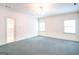 Empty bedroom with a ceiling fan and access to an en-suite bathroom at 260 Emerald Lake Dr, Fayetteville, GA 30215