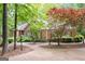 Attractive home showcasing a brick facade, lush greenery, and a curved driveway at 260 Emerald Lake Dr, Fayetteville, GA 30215