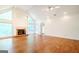 Expansive living room featuring hardwood floors, fireplace, and vaulted ceilings at 260 Emerald Lake Dr, Fayetteville, GA 30215