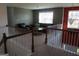 Upstairs living room with ample natural light and cozy seating at 6974 Chilkat Sw Ct, South Fulton, GA 30331