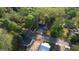 Aerial view showcasing a charming home with a long driveway and a well-maintained yard in a quiet neighborhood at 2228 Emory Sw St, Covington, GA 30014