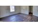 Empty bedroom with hardwood floors and natural light at 2228 Emory Sw St, Covington, GA 30014