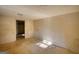 Spacious bedroom featuring tile floors, neutral walls, and a doorway, offering a versatile living space at 2228 Emory Sw St, Covington, GA 30014