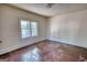 Empty bedroom features wood floors, neutral walls, and a window providing natural light at 2228 Emory Sw St, Covington, GA 30014