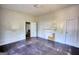 This vacant bedroom with hardwood floors has a vintage fireplace at 2228 Emory Sw St, Covington, GA 30014