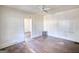 Vacant room with hardwood flooring and ceiling fan at 2228 Emory Sw St, Covington, GA 30014