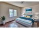 Bedroom staged with a bed and an ocean view wall art at 2228 Emory Sw St, Covington, GA 30014