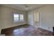Vacant bedroom featuring hardwood floors and bright window at 2228 Emory Sw St, Covington, GA 30014