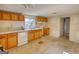 Kitchen with wood cabinets, double sink, dishwasher and natural light at 2228 Emory Sw St, Covington, GA 30014