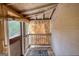Cozy covered porch featuring wood slats and a window, providing a charming outdoor space at 2228 Emory Sw St, Covington, GA 30014