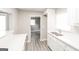 Bright eat-in kitchen featuring updated cabinets, modern appliances, and stylish gray flooring at 322 E Rhinehill Rd, Atlanta, GA 30315