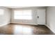 Bright living room featuring pristine hardwood floors and a freshly painted interior at 322 E Rhinehill Rd, Atlanta, GA 30315
