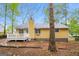 Charming home exterior featuring a wooden deck and well-maintained siding at 5998 Radford Dr, Riverdale, GA 30296