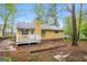 Charming home exterior featuring a wooden deck and well-maintained siding at 5998 Radford Dr, Riverdale, GA 30296