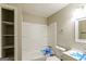 Bathroom featuring white bathtub and vanity with a shower and storage space at 5998 Radford Dr, Riverdale, GA 30296